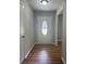 Bright foyer featuring wood floors and decorative front door at 2266 Eastgate Dr, Snellville, GA 30078