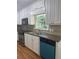 Functional kitchen with white cabinetry, stainless steel appliances, and laminate countertops at 2266 Eastgate Dr, Snellville, GA 30078