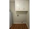 Laundry area with upper cabinets and hook ups at 2266 Eastgate Dr, Snellville, GA 30078
