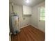 Laundry room with storage cabinets and a water heater at 2266 Eastgate Dr, Snellville, GA 30078