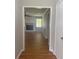 View of living room with brick fireplace from hall at 2266 Eastgate Dr, Snellville, GA 30078