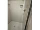 Bright tiled shower featuring a shower head, soap dish, and glass enclosure at 2266 Eastgate Dr, Snellville, GA 30078
