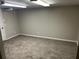 Spacious room in basement with neutral carpet and lighting at 3551 Skyline Sw Ter, Marietta, GA 30008