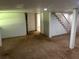 Finished basement with neutral carpet and access to stairs at 3551 Skyline Sw Ter, Marietta, GA 30008