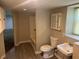 Basement bathroom featuring a shower, toilet, sink, and storage at 3551 Skyline Sw Ter, Marietta, GA 30008