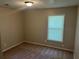 Neutral bedroom showcases natural light, blinds, and carpet at 3551 Skyline Sw Ter, Marietta, GA 30008