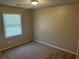 Cozy bedroom featuring neutral walls and plush carpet creating a relaxing atmosphere at 3551 Skyline Sw Ter, Marietta, GA 30008