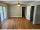 Bright living room features hardwood floors, neutral walls and french doors at 3551 Skyline Sw Ter, Marietta, GA 30008