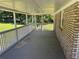 Expansive covered porch offering ample space for outdoor seating and entertaining at 3551 Skyline Sw Ter, Marietta, GA 30008