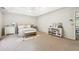 Spacious bedroom featuring a decorative bed, tray ceiling and natural light at 4630 Smokestone Dr, Douglasville, GA 30135