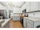 Modern kitchen featuring white cabinets, stainless steel appliances, and granite countertops at 4630 Smokestone Dr, Douglasville, GA 30135