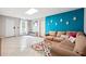 Inviting living area with tile floors, a plush couch, and colorful decor at 4630 Smokestone Dr, Douglasville, GA 30135