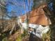 Old, brown, single wide home needing repair with a set of wooden stairs at 85 Lang Cir, Covington, GA 30014