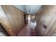 Narrow hallway with linoleum floors leading to other areas of the home at 85 Lang Cir, Covington, GA 30014