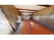Living room with orange linoleum floor and wood-paneled walls at 85 Lang Cir, Covington, GA 30014