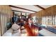 Open-concept living room with wood beams and plenty of natural light at 85 Lang Cir, Covington, GA 30014