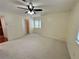 Spacious carpeted bedroom with ceiling fan and ample natural light at 1503 Wingate Way # 1503, Sandy Springs, GA 30350