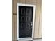 Image of the attractive front door with sleek hardware, enhancing the curb appeal of the home at 1503 Wingate Way # 1503, Sandy Springs, GA 30350