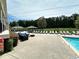 Community pool area with lounge chairs and outdoor seating spaces at 1503 Wingate Way # 1503, Sandy Springs, GA 30350