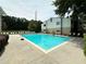 Community pool with ample seating and a well-maintained deck at 1503 Wingate Way # 1503, Sandy Springs, GA 30350
