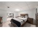 Cozy bedroom with tile flooring, wood furniture, and sitting area at 1560 Boxwood Nw Trce, Acworth, GA 30102
