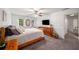 Spacious bedroom featuring a ceiling fan, wood furniture, and plenty of natural light from the windows at 1560 Boxwood Nw Trce, Acworth, GA 30102