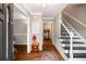 Warm and welcoming foyer with hardwood floors, staircase, and decorative accents at 1560 Boxwood Nw Trce, Acworth, GA 30102