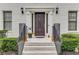 Inviting front entry with brick steps, a dark wood door and decorative details at 1560 Boxwood Nw Trce, Acworth, GA 30102