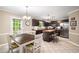 Eat-in kitchen with stainless steel appliances, island and dining table with backyard view at 1560 Boxwood Nw Trce, Acworth, GA 30102
