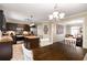 Kitchen with island and stainless steel appliances open to the dining area at 1560 Boxwood Nw Trce, Acworth, GA 30102