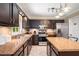 Kitchen with island, stainless steel appliances, neutral tiled backsplash, and granite countertops at 1560 Boxwood Nw Trce, Acworth, GA 30102