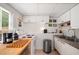 Kitchenette area with bright white cabinets, stainless steel sink and appliances at 1560 Boxwood Nw Trce, Acworth, GA 30102