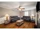 Inviting living room featuring hardwood floors, comfortable seating, and neutral decor at 1560 Boxwood Nw Trce, Acworth, GA 30102