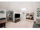 Open-concept living room featuring tile flooring, sitting area, and mini kitchen at 1560 Boxwood Nw Trce, Acworth, GA 30102