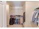 Walk in closet with clothing racks on both sides at 2990 Haynes Club Cir, Grayson, GA 30017