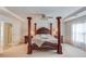 Spacious main bedroom with a four-poster bed, offering a luxurious and comfortable retreat at 2990 Haynes Club Cir, Grayson, GA 30017