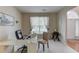 Functional home office with desk, chair, and ample natural light from the large window at 2990 Haynes Club Cir, Grayson, GA 30017