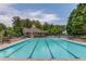 Community swimming pool with multiple lap lanes, lounge chairs and a covered pavilion at 2990 Haynes Club Cir, Grayson, GA 30017
