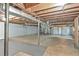 The unfinished basement has a concrete floor, exposed ducts and support pillars at 4025 Cheoah Dr, Douglasville, GA 30135