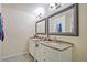 Bright bathroom featuring dual vanities with granite countertops and tiled floor at 4025 Cheoah Dr, Douglasville, GA 30135