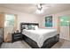 Comfortable bedroom with a platform bed that has drawers and a ceiling fan at 4025 Cheoah Dr, Douglasville, GA 30135