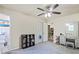 This bedroom includes a ceiling fan, carpeted floors, a closet, and a vanity with a mirror at 4025 Cheoah Dr, Douglasville, GA 30135