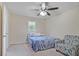 Neutral bedroom with a blue comforter on the bed, featuring a ceiling fan at 4025 Cheoah Dr, Douglasville, GA 30135