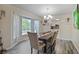Inviting dining area with bright bay window, stylish decor, and a view to the kitchen at 4025 Cheoah Dr, Douglasville, GA 30135