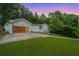 Charming home with a modern garage door and lush landscaping at 4025 Cheoah Dr, Douglasville, GA 30135