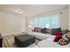 Cozy living room features a white couch and large ottoman near a window at 4025 Cheoah Dr, Douglasville, GA 30135