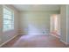 Bright bedroom with plush carpeting and large window with exterior view at 5167 Hiram Lithia Springs Rd, Powder Springs, GA 30127