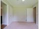 Neutral bedroom featuring carpeted floors, two closets, and natural light at 5167 Hiram Lithia Springs Rd, Powder Springs, GA 30127