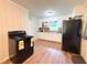 A traditional kitchen with light-colored cabinets and contrasting countertops at 5167 Hiram Lithia Springs Rd, Powder Springs, GA 30127