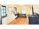 Cozy kitchen with wood floors and an adjacent dining area by a window at 5167 Hiram Lithia Springs Rd, Powder Springs, GA 30127